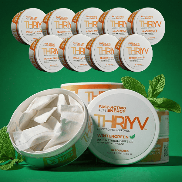 THRYV nootropic pouches with green leaves on a green background
